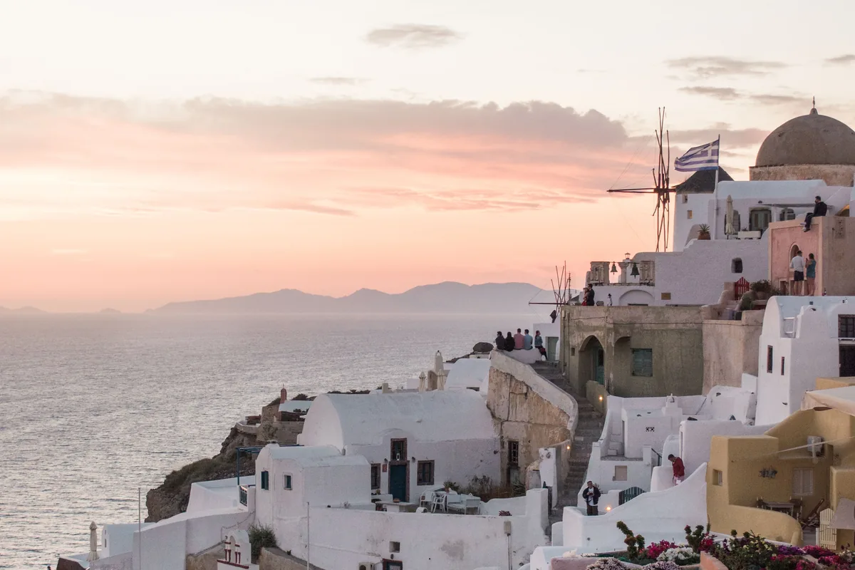 Whitewashed Santorini buildings overlooking the Aegean Sea